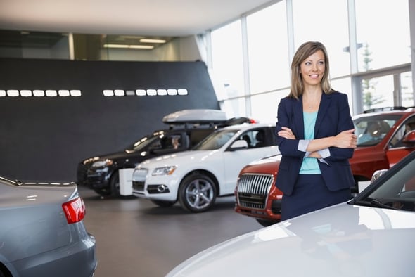 woman in car dealership